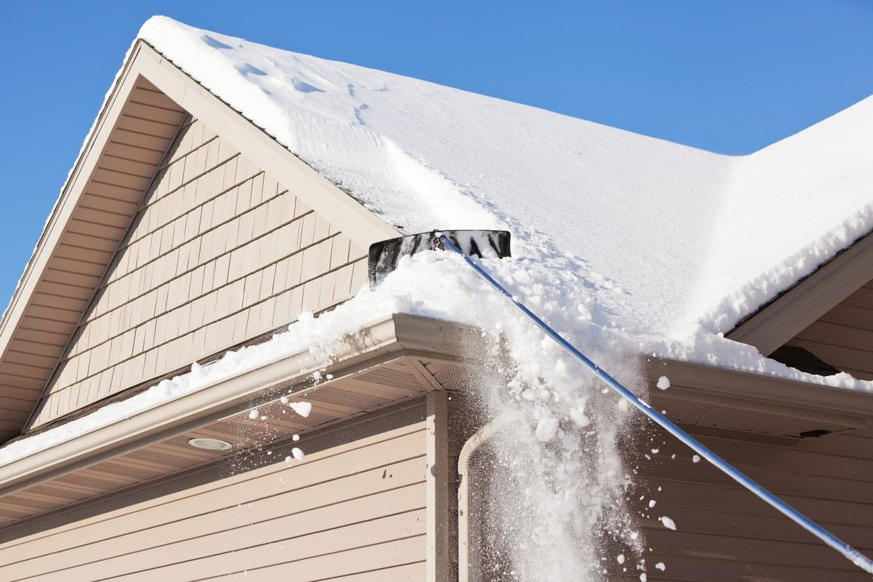 Removing Snow From Roofs With Brush - Piedmont Roofing
